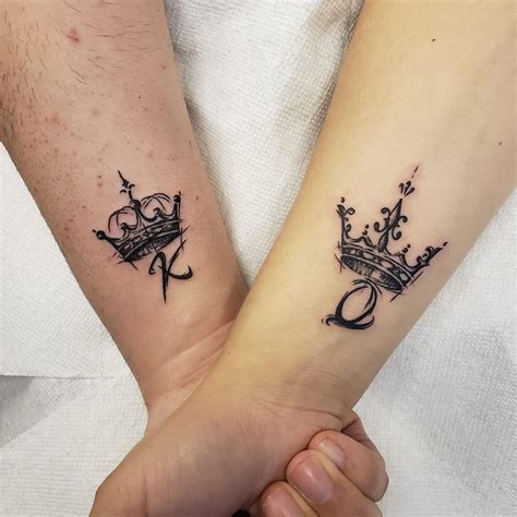 King queen tattoo - This king queen tattoo is inspired by the chess; where the man has the king whereas the women rule with the queen tattoo. 2. The Crown Tattoo. This is another gem in our list of king and queen tattoo. The tattoos are inked in black colour and have perfect 3d look of the crown.